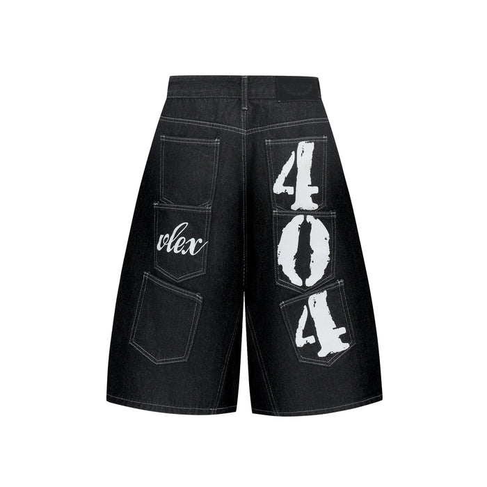 Back view of black denim shorts with patch pockets and large white graphic prints