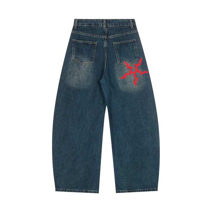 Back view of dark blue wide-leg jeans with rear pockets and a red Gothic emblem