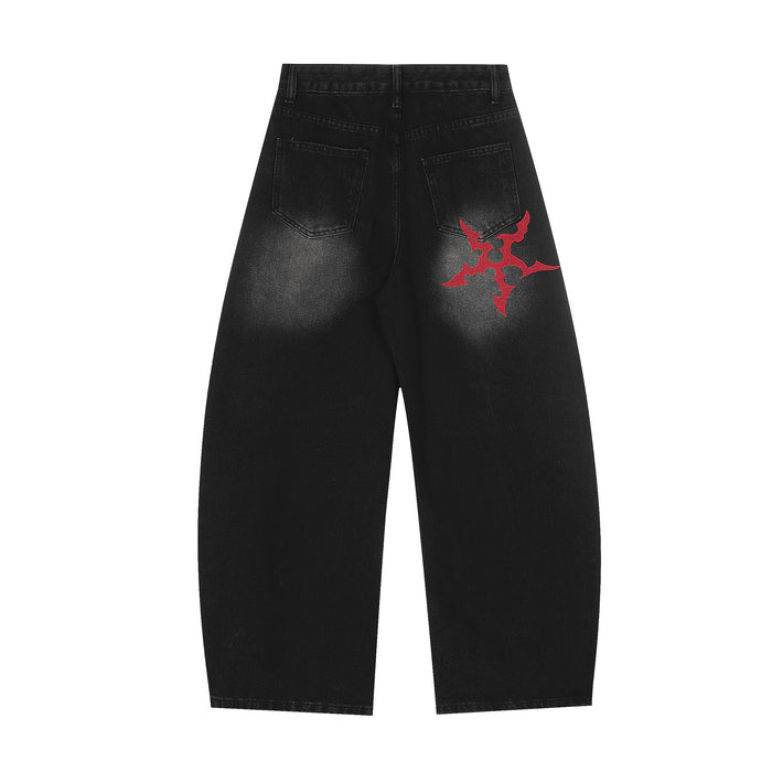 Back view of black wide-leg jeans with rear pockets and a red Gothic emblem