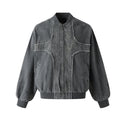 Deconstructed cross-patch washed denim bomber jacket with frayed seams in washed grey, front view