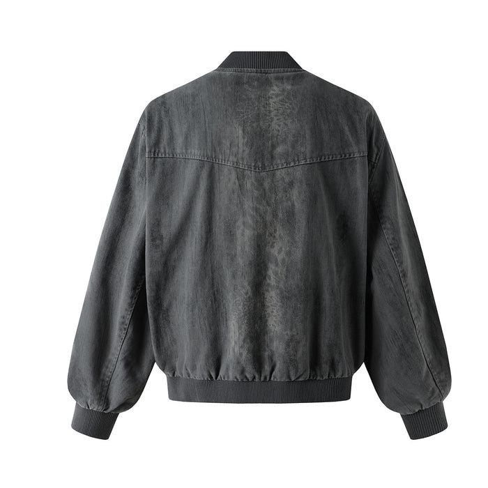 Gray washed denim bomber jacket shown from the back with a horizontal yoke seam and ribbed cuffs