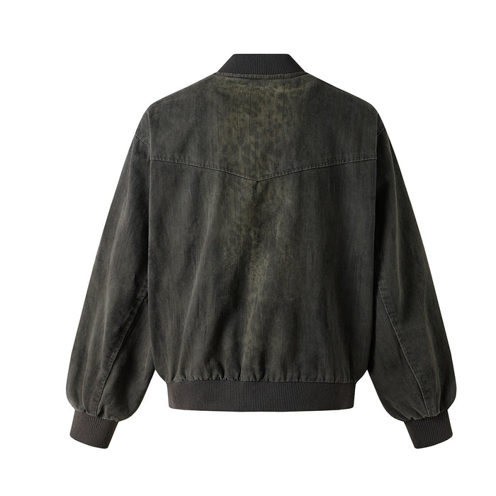 Dark olive washed denim bomber jacket shown from the back with a plain panel and ribbed hem