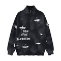Oversized distressed cross jacquard zip-up knit cardigan sweater in black with ripped holes and gothic lettering