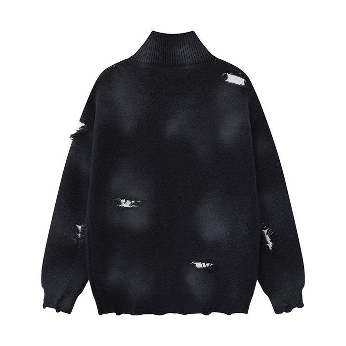 Black zip-up knit cardigan shown from the back with a ribbed high collar, distressed holes, and uneven hem