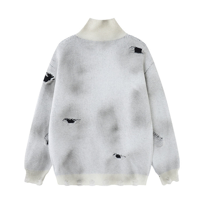 Light gray knit cardigan shown from the back with cream ribbed collar and cuffs plus scattered distressed holes