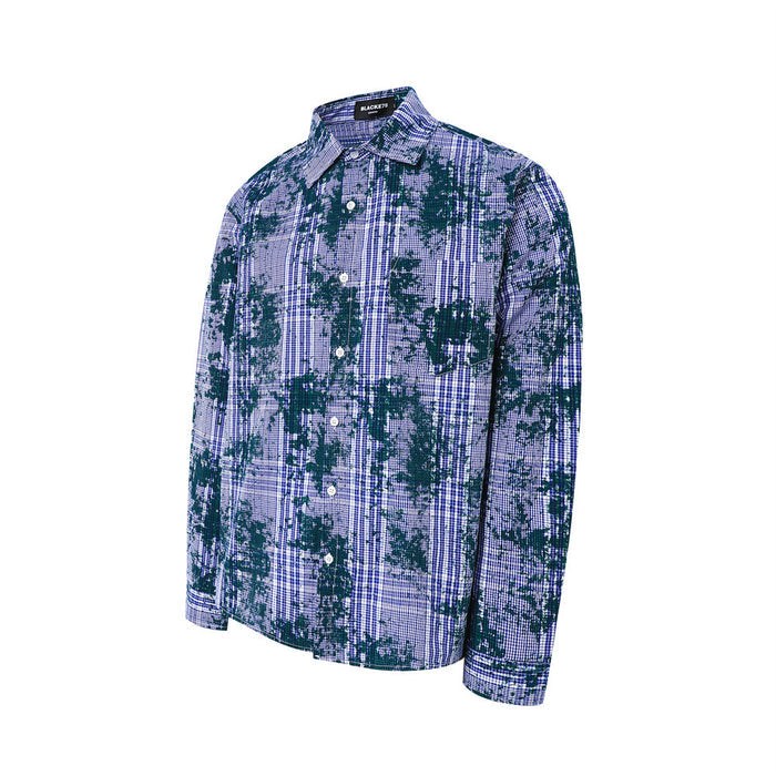 Blue plaid long sleeve button-up shirt with distressed dark green pattern, angled front view