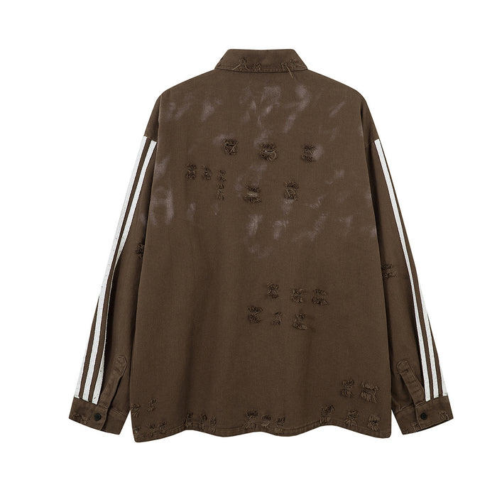 Back view of the brown distressed polo shirt showing white triple sleeve stripes and scattered frayed details