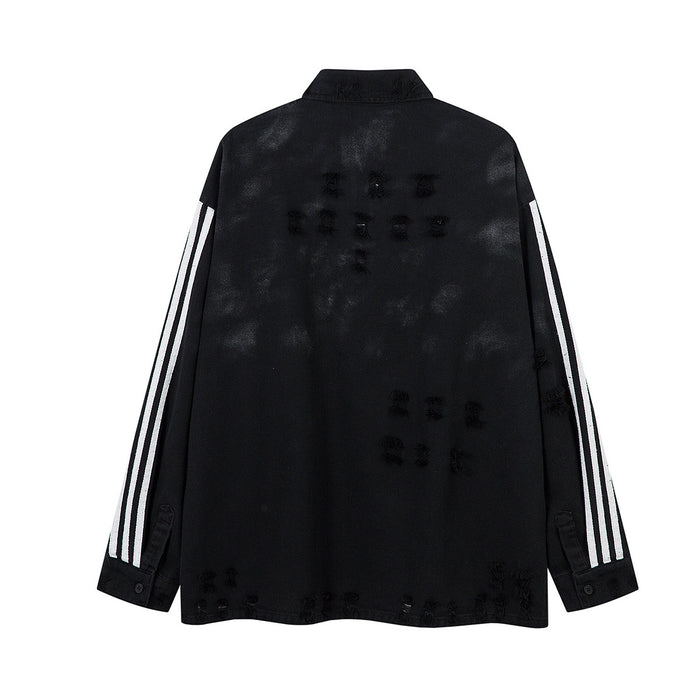 Back view of the black distressed polo shirt with white triple sleeve stripes and scattered frayed details