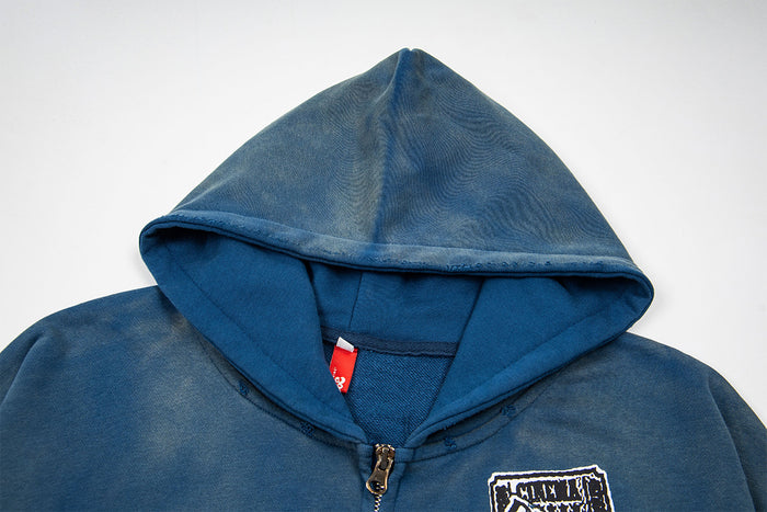 Close-up of the washed blue hood, inner lining, zipper, and neckline seam