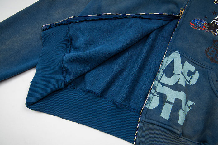 Open washed blue hoodie showing the zipper, inner pouch pocket lining, ribbed hem, and front print