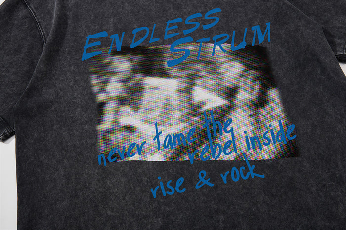 Black acid wash T-shirt front print with ENDLESS STRUM text and blurred grayscale graphic