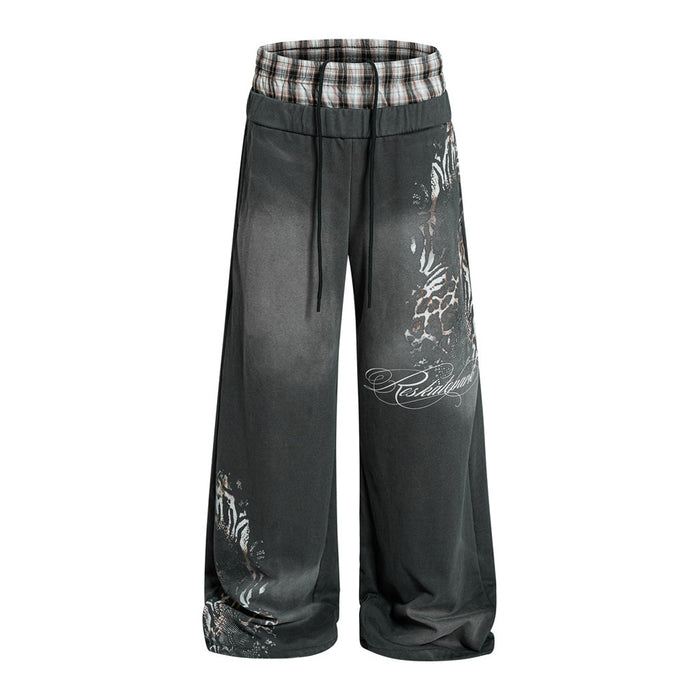 Wide leg gray sweatpants with plaid waistband and leopard print graphics, front view