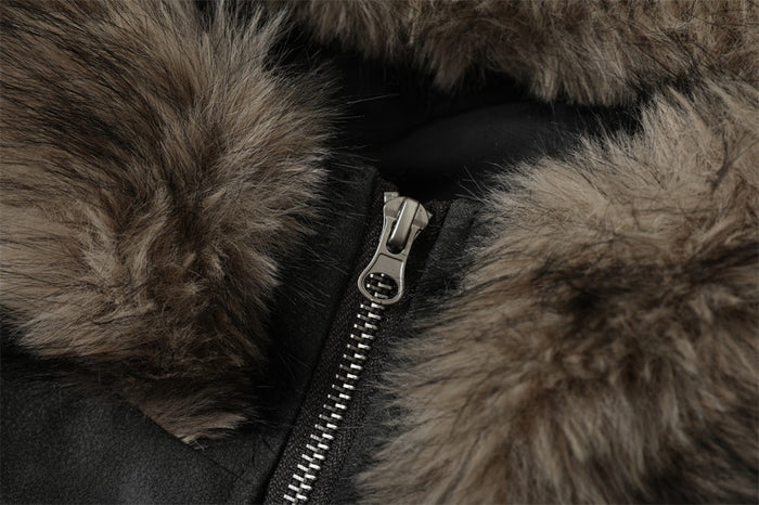 Close-up of jacket hood zipper framed by thick faux fur trim