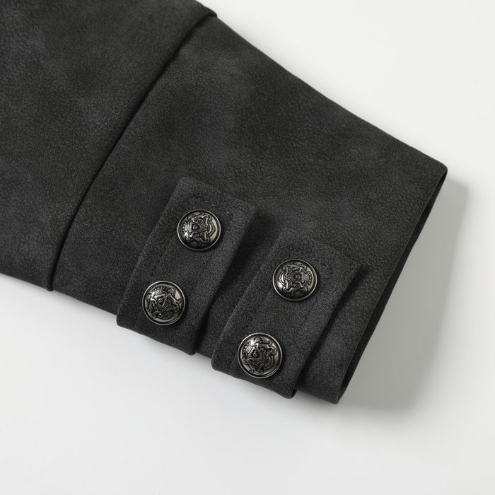 Close-up of black jacket sleeve cuff with four embossed snap buttons