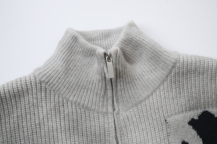 Close-up of the gray ribbed knit sweater jacket collar and metal front zipper