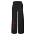 Wide-leg sweatpants with gothic cross print on left leg in black with red print and light grey with black print