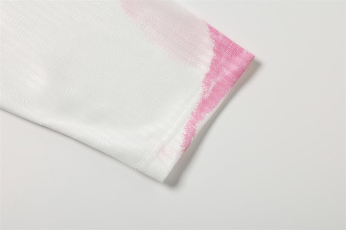 Close-up of white sleeve cuff with pink painted edge