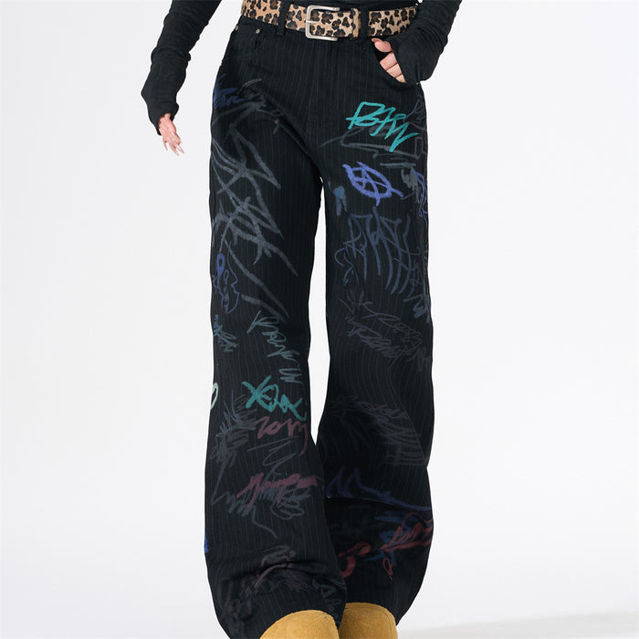 Front view of black pinstripe wide-leg jeans with multicolor graffiti print