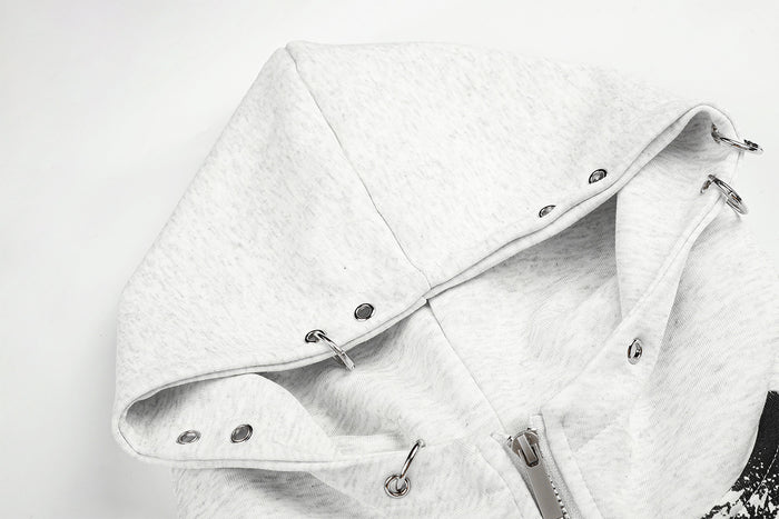 Close-up of the light grey hoodie hood showing snap fasteners, drawcord hardware, and soft fleece texture