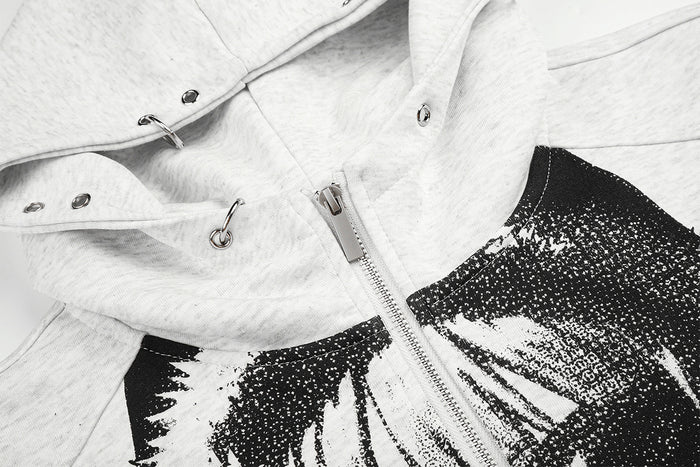 Close-up of the hoodie front showing the metal zipper, snap details, and black graphic print
