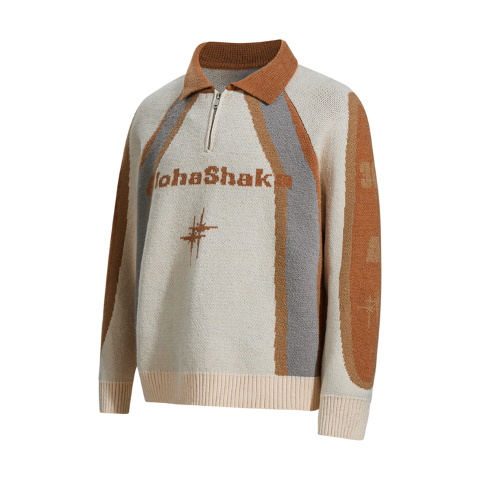 Tan and gray colorblock knit sweater, angled front view with half zip and graphic