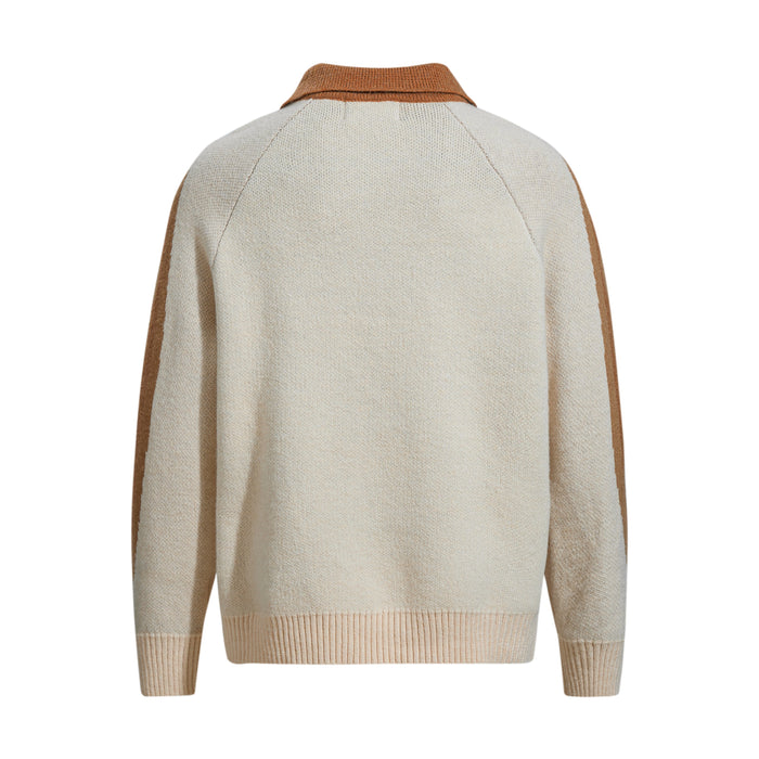 Back view of tan and cream knit sweater with brown collar and long sleeves