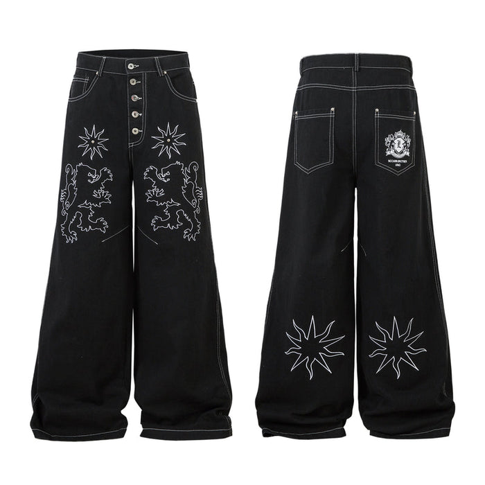 Black wide-leg jeans with white heraldic lion and star outline embroidery on the front legs, shown front and back