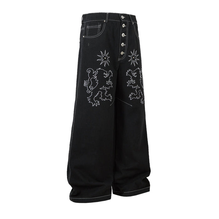 Black wide-leg jeans with lion and star embroidery, angled side view