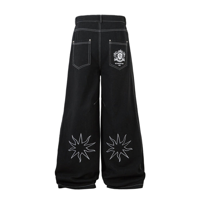 Back view of black wide-leg jeans with star embroidery and embroidered back pocket