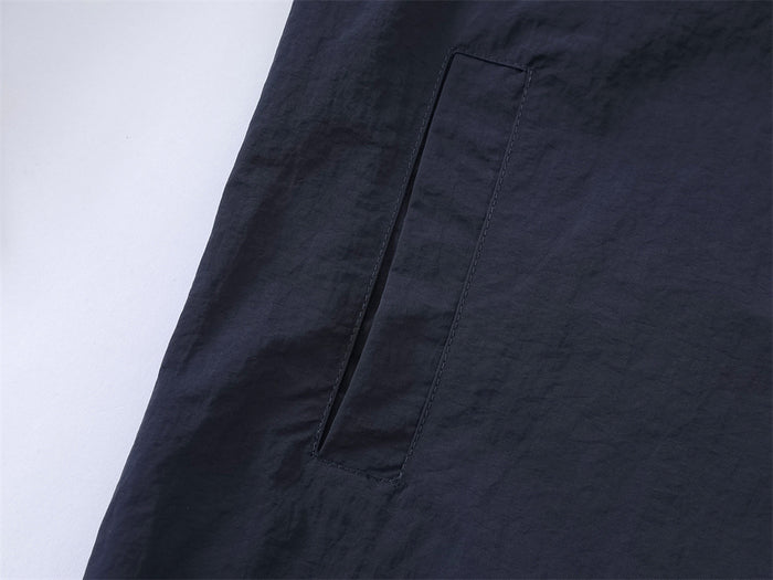 Close-up of patch pocket on navy overshirt body
