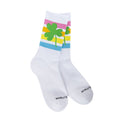 A pair of white athletic socks with colorful horizontal stripes and green shamrock designs on the cuffs.