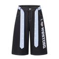 Front view of black wide-leg denim shorts with light blue polka dot tie belt and I ♥ RUNTENG print