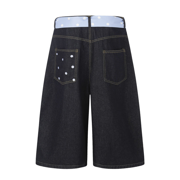 Back view of black wide-leg denim shorts with polka dot waistband and back pockets