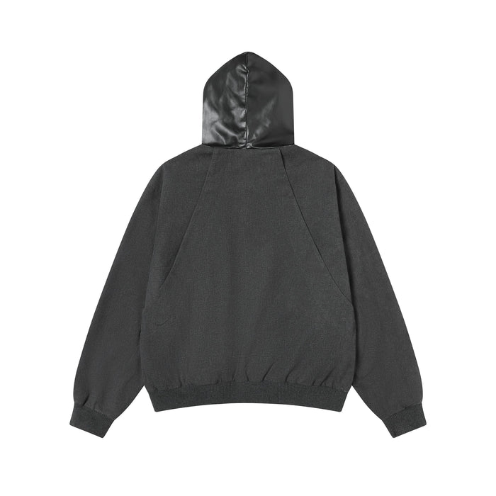 Back view of black hooded jacket with smooth faux leather hood and ribbed hem