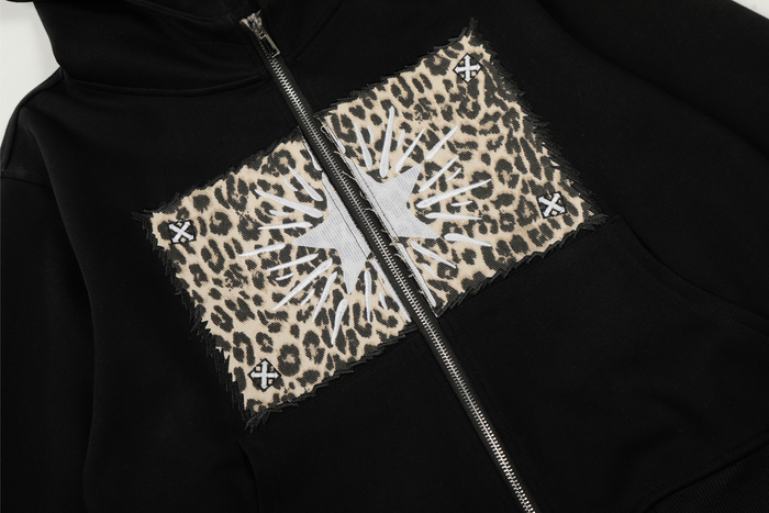 Front chest view of black hoodie with leopard-print cat graphic panel