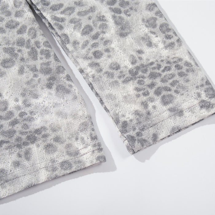 Close-up of leopard print long sleeve cuffs and hem