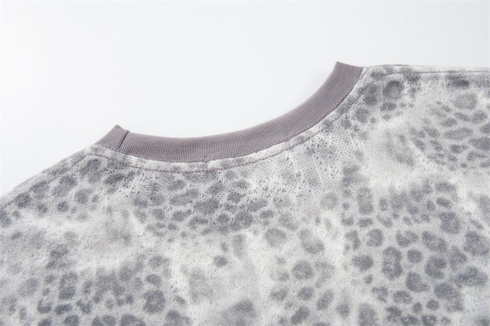 Back neckline close-up of leopard print crew neck T-shirt