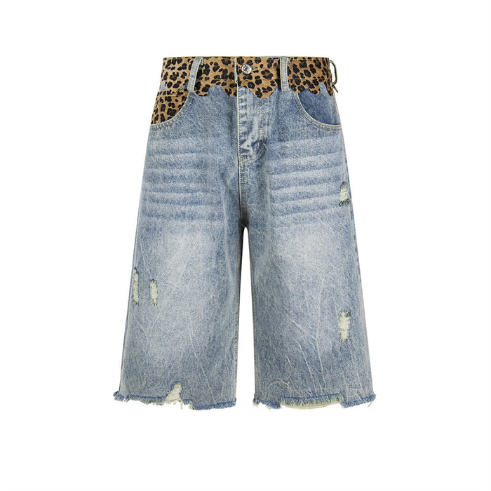 Front view of light wash distressed denim shorts with leopard print waistband