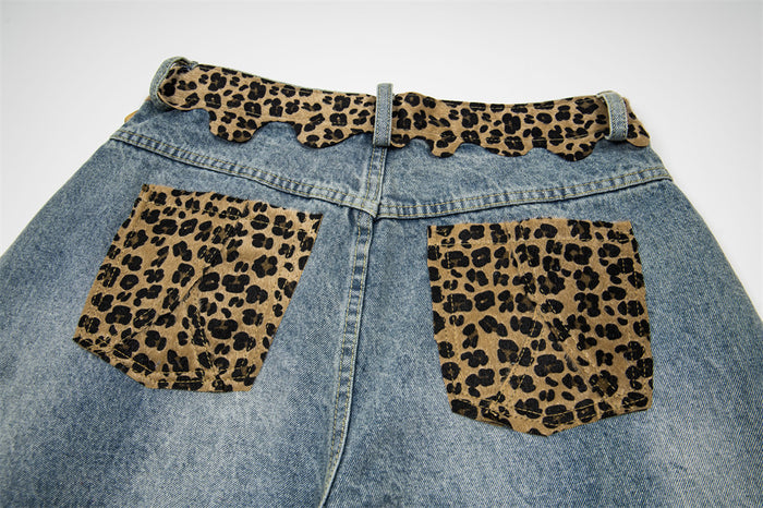 Back view of light wash denim shorts with leopard print waistband and back pockets