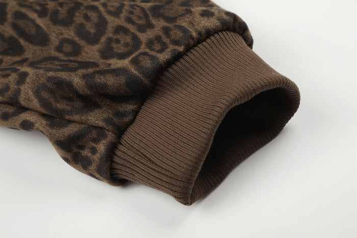 Close-up of the bomber jacket sleeve ending in a wide ribbed brown cuff