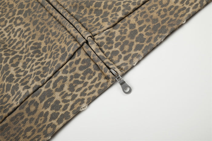 Close-up of leopard print hoodie zipper pull at the hem