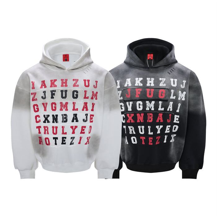 White and black oversized hoodies with distressed red, white, and black letter grid graphics