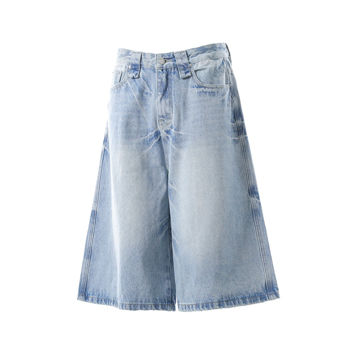 Light wash wide-leg denim shorts front view with faded whiskering and wide legs