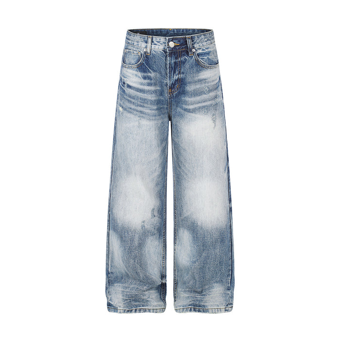 Light washed wide-leg baggy jeans with heavy whisker distressing and bleached cloud wash effect, front and back view