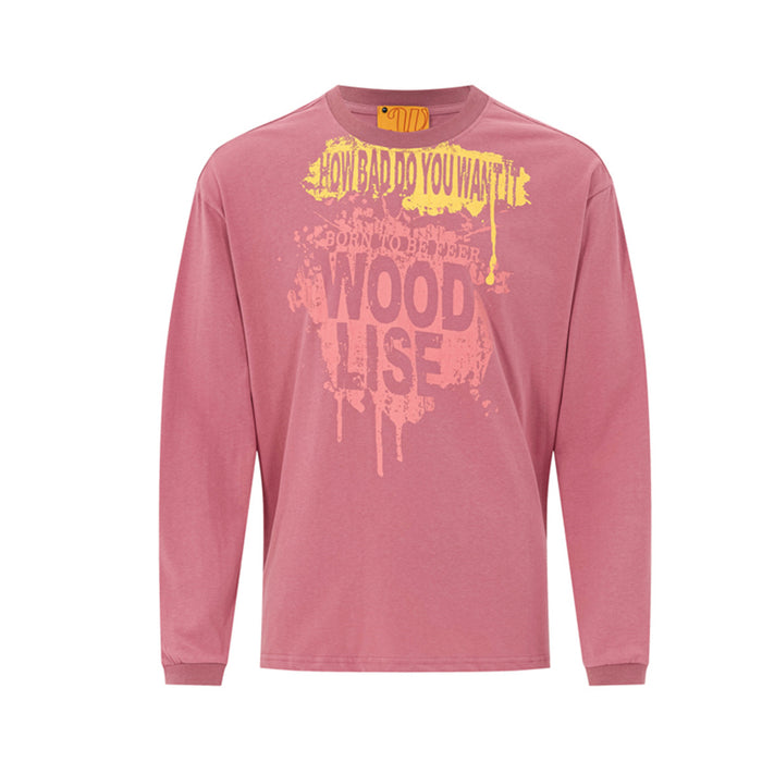 Long sleeve graphic tee with graffiti paint splash print in dusty pink, crew neck relaxed fit streetwear shirt