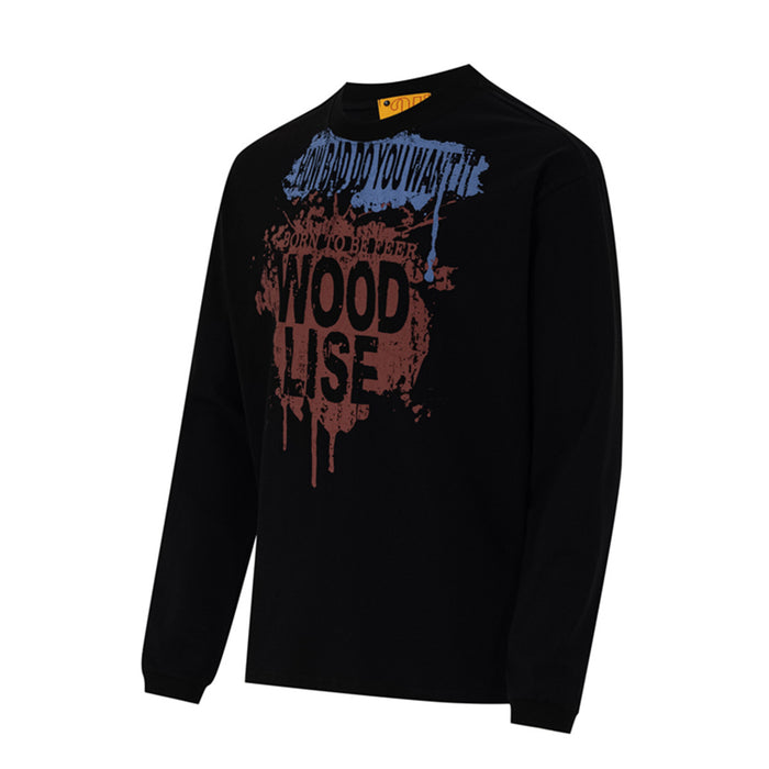Angled front view of a black long sleeve tee showing its blue and reddish-brown paint splash graphic