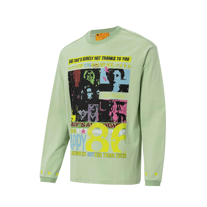Angled front view of the light green long sleeve tee with a colorful retro graphic print and ribbed cuffs