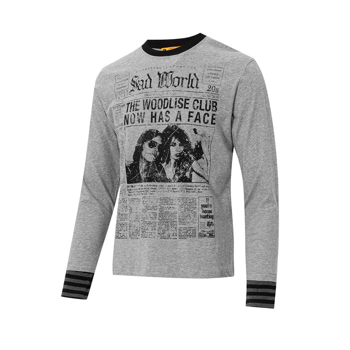 Angled front view of gray long sleeve shirt with newspaper graphic and striped sleeve cuffs
