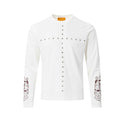 White long sleeve tee front with silver studded cross design and burgundy ornate sleeve graphics