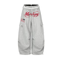 Loose fit wide-leg cargo sweatpants with embroidered Maxdepy logo in heather gray, featuring snap cargo pockets and branded e
